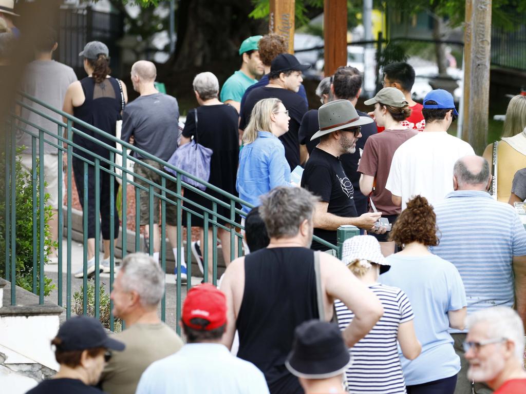 Voters and party members line up at the Coorparoo State School during the elections. Picture: NCA NewsWire/Tertius Pickard