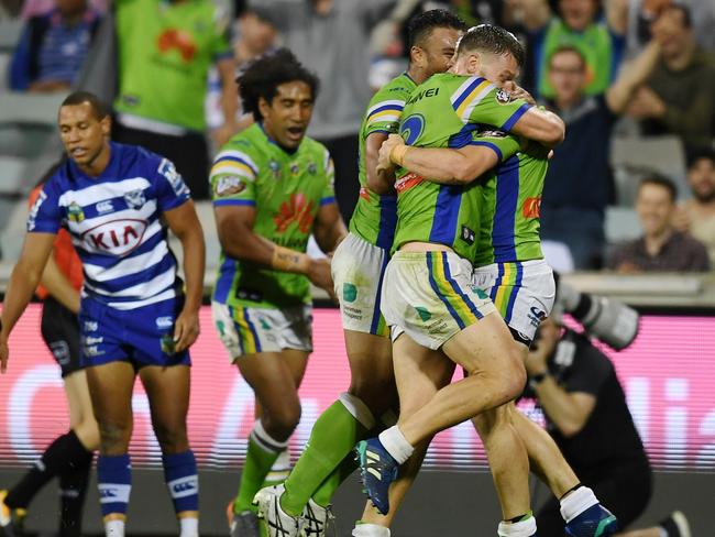 Jarrod Croker celebrates with team mates after scoring a try.