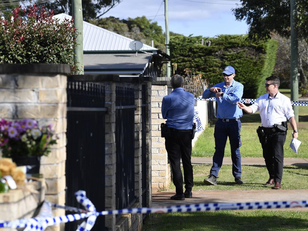 Police and a Queensland Government employee at the scene. Picture: Kevin Farmer