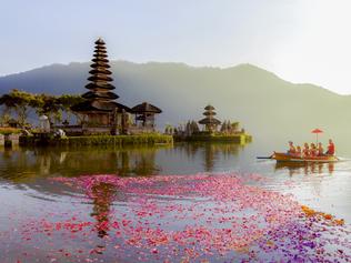 ESCAPE:  Beratan Lake in Bali Indonesia,  6 March 2017 : Balinese villagers participating in traditional religious Hindu procession in Ulun Danu temple Beratan Lake in Bali Indonesia  Picture: Istock