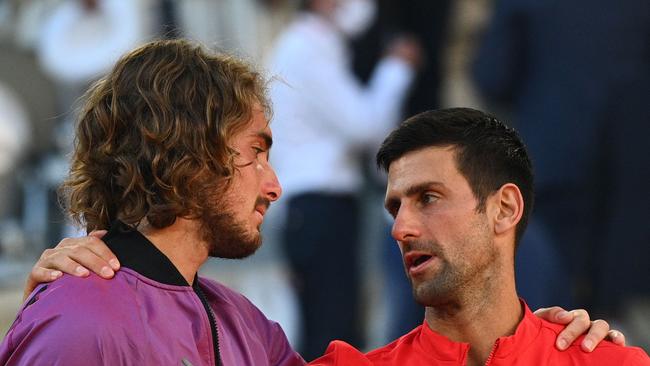 Novak Djokovic (right) talks with Stefanos Tsitsipas during the trophy ceremony. Picture: AFP