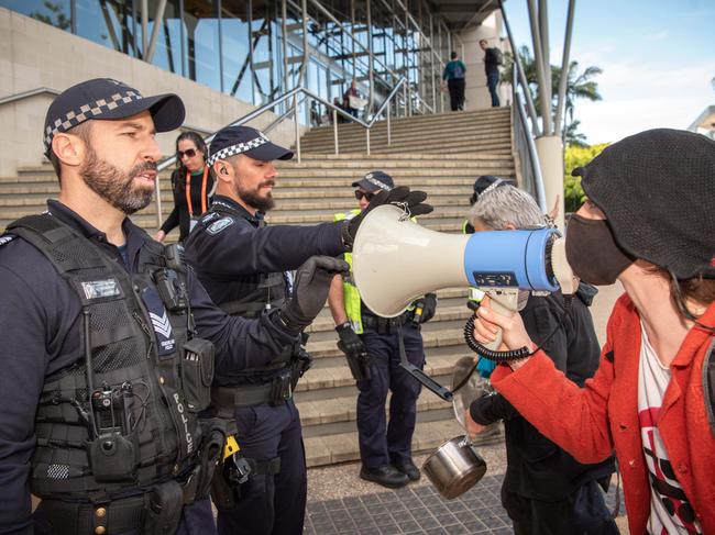 Anti-war protesters on the steps of the Brisbane Convention and Exhibition Centre as they protest outside the Land Forces Expo in 2021. Picture: Brad Fleet