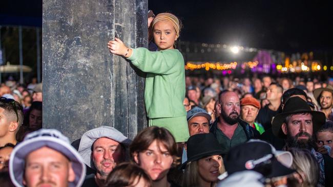 A young music fan finds a better vantage point at Byron Bay Bluesfest on April 15, 2022. Picture: Joseph Mayers