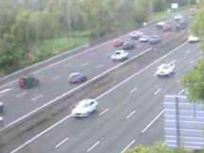 Car rolls on M1 at Nerang. Picture: Department of Transport and Main Roads