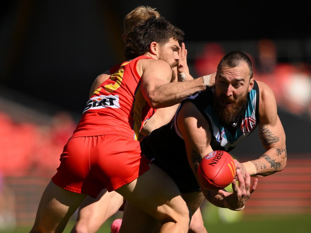 GOLD COAST, AUSTRALIA – JULY 14: Charlie Dixon of the Power handballs under pressure during the round 18 AFL match between Gold Coast Suns and Port Adelaide Power at People First Stadium, on July 14, 2024, in Gold Coast, Australia. (Photo by Matt Roberts/AFL Photos/via Getty Images)