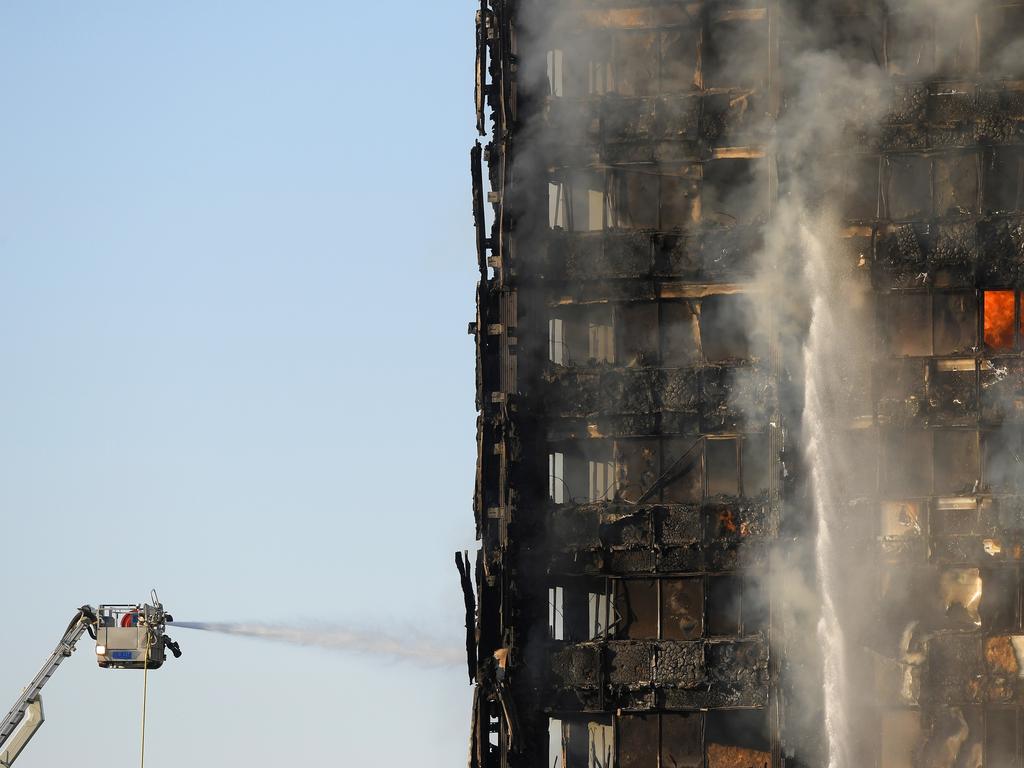 Firefighters direct water at the blaze. Picture: Reuters/Toby Melville