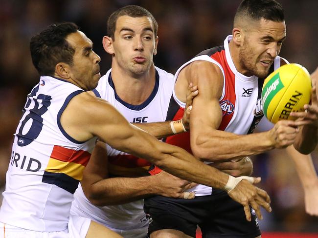 Eddie Betts and Taylor Walker make life difficult for Shane Savage. Picture: Michael Klein