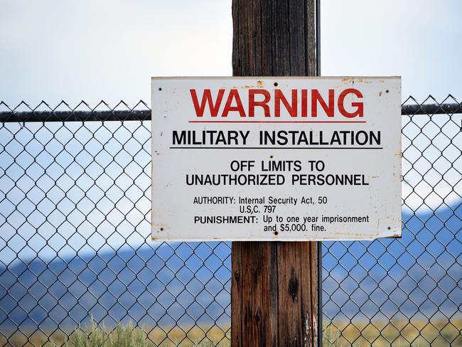 A warning sign is posted at the back gate at the top-secret military installation at the Nevada Test and Training Range known as Area 51 near Rachel, Nevada. Picture: AFP