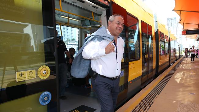 Mayor Tom Tate hops off the light rail at Broadbeach. He’s calling for funding for three major city projects, including the extension of the tram. Picture: Glenn Hampson