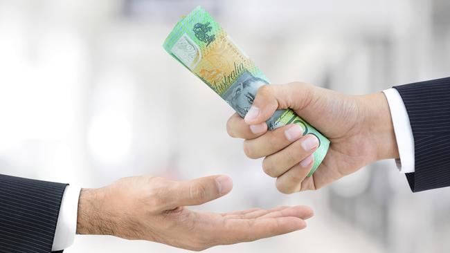 Businessman hands passing money, Australian dollar bills, tax refund generic