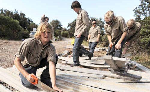 Replacing the plastic pathway on the 4WD access track to Seven Mile Beach at Lennox head are EnviTE workers (from left) Nick Cook, Nathan Lewins (obscured), Sam O’Keefe, Claire Mangnall, Jamie Heard and Travis Peters. Picture: Cathy Adams