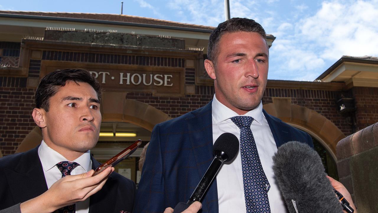 Sam Burgess (right) speaks to the media before leaving the Moss Vale Local Court