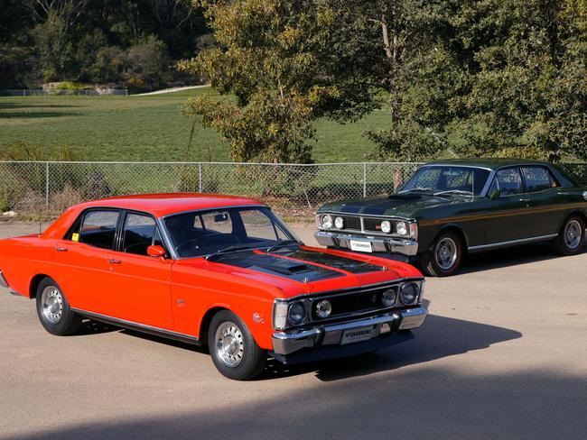 A 1970 Ford XW Falcon GTHO Phase II (orange) and a 1971 Ford XY Falcon GTHO Phase III (green).