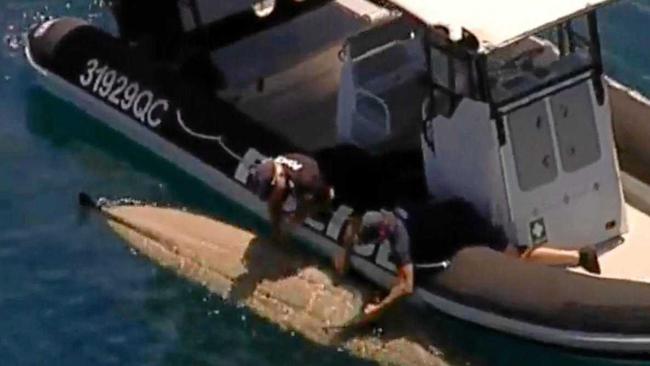 Police have retrieved a kayak after a man was knocked into the water by a large tiger shark off Moffat Beach this morning. Picture: Contributed
