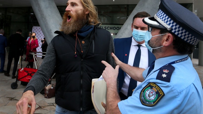 A man claiming to be the "prime creator of the earth" interrupted NSW Police Commissioner Mick Fuller's announcements at Monday's COVID press conference. Picture: Lisa Maree Williams/Getty Images