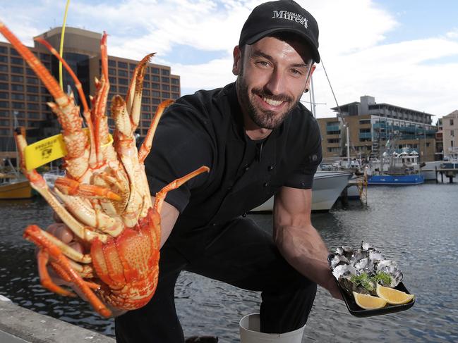 Jono Douglas from Mures with a Southern Rock Lobster and oysters for sale for Christmas day PICTURE: Luke Bowden