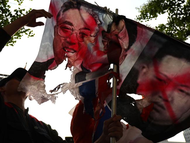 Not all South Koreans are thrilled about the summit with protesters making their views known ahead of the meeting by burning pictures of the North Korean regimen. Picture: Chung Sung-Jun/Getty Images