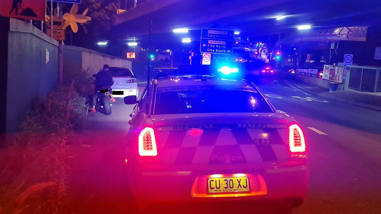 NSW Highway patrol nab a learner motorbike rider and P1 driver at more than 120km/h on the ANZAC bridge. Source: NSW Highway Patrol Facebook