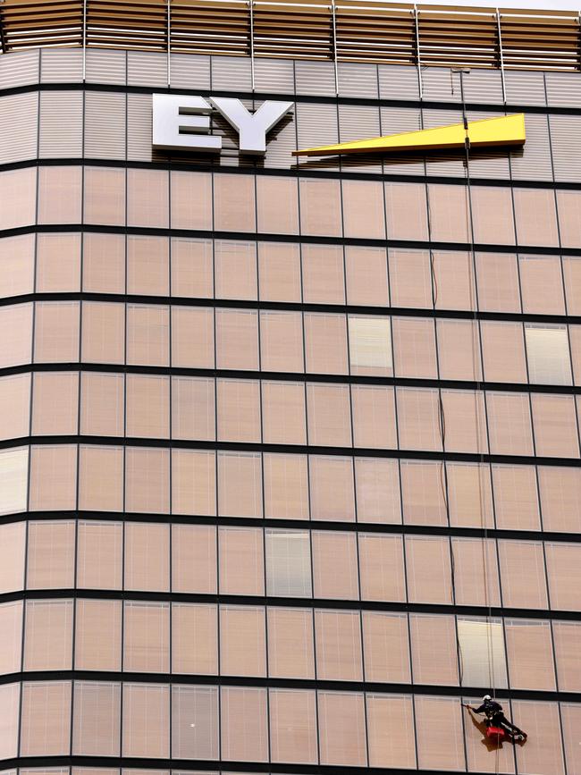 A window washer washing windows on the EY building on George Street in the Sydney CBD. Picture: NCA NewsWire / Damian Shaw