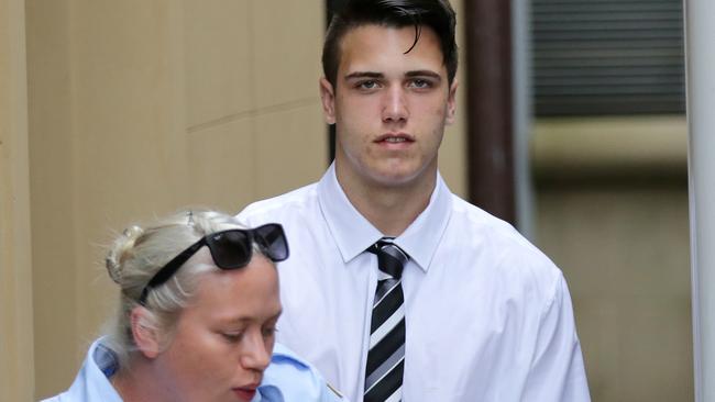 Bradley Brooks being led into a prison truck from the King St Courts in Sydney. Picture: Christian Gilles