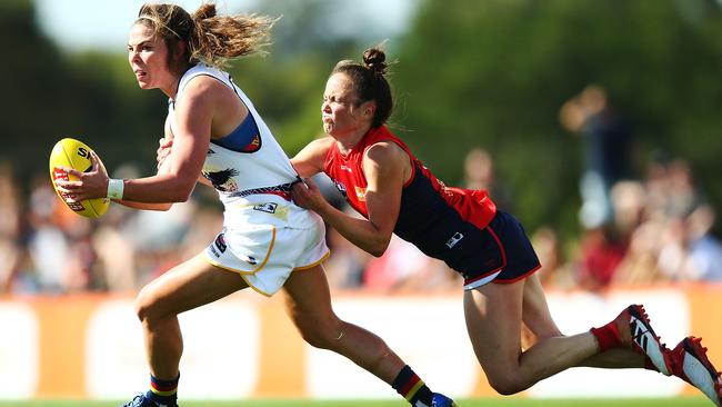 Demons Daisy Pearce tackles Adelaide’s Jenna McCormick in the AFLW at Casey Fields in Melbourne. Picture: Michael Dodge/Getty