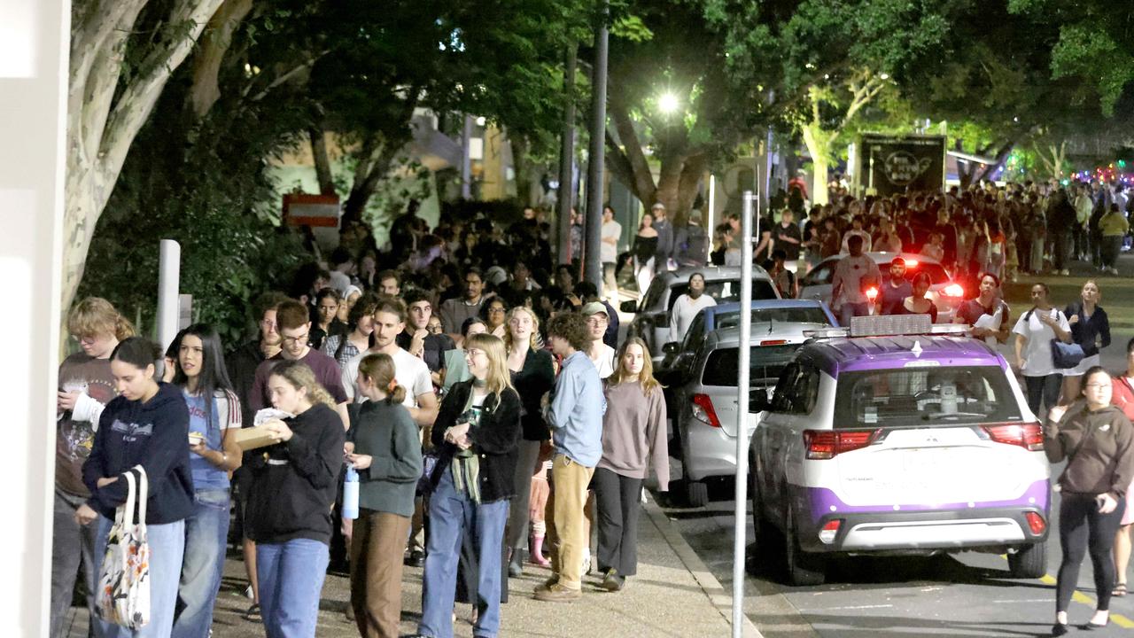 Students line up to vote as a bomb threat causes evacuations at UQ’s St Lucia campus. Picture: Steve Pohlner