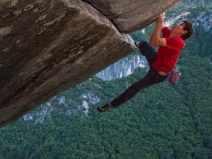 timeOUT: Banff Mountain Film Festival. Alex Honnold making a rope-less ascent of the famous Seperate Reality, a difficult over hanging hand rack that is perched 500ft. above the Valley floor. This route has only been done rope-less three other times.