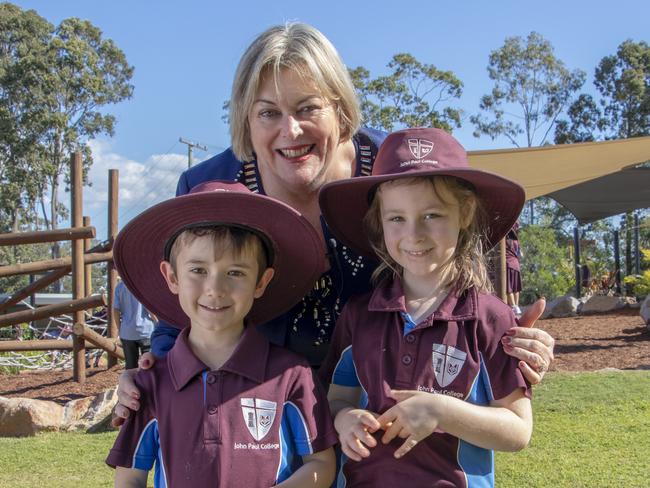 Principal Karen Spiller with young John Paul College students. Photo: supplied