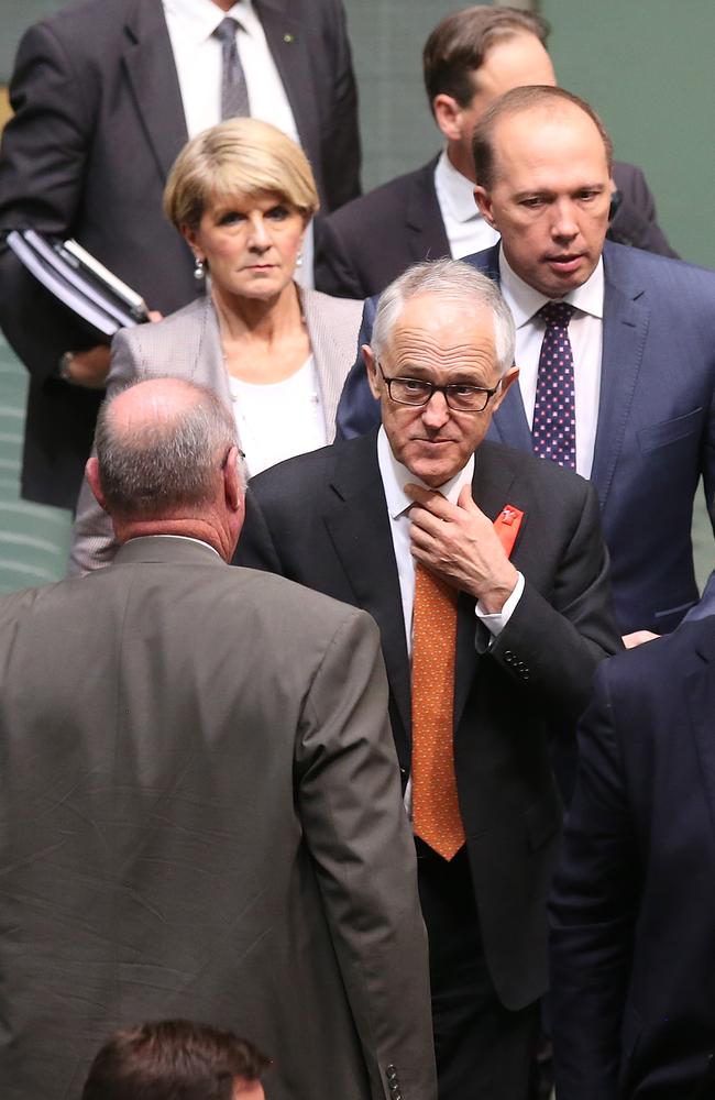 Warren Entsch (back to camera) passes Prime Minister Malcolm Turnbull after the Plebiscite (Same-Sex Marriage) Bill vote in the House of Representatives. Picture Kym Smith