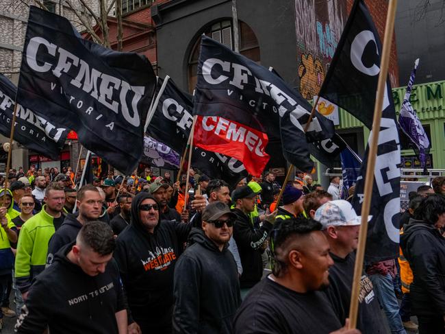 MELBOURNE, AUSTRALIA - AUGUST 27: CFMEU members march in protest on August 27, 2024 in Melbourne, Australia. Thousands of union members across Victoria participated in a march on Tuesday morning to show solidarity with the Construction, Forestry, Maritime, Mining and Energy Union (CFMEU). The strikes come in response to new legislation that forces the CFMEU to accept administration following allegations of criminal links and corruption. The new legislation, which passed the Senate with support from the Opposition, gives the relevant minister the power to appoint an administrator. The CFMEU has criticized the law, saying it stripped members of the right to a fair process and has flagged a legal fight. Prime Minister Anthony Albanese dismissed the union's criticism, stating that it is "business as usual from the CFMEU". (Photo by Asanka Ratnayake/Getty Images)