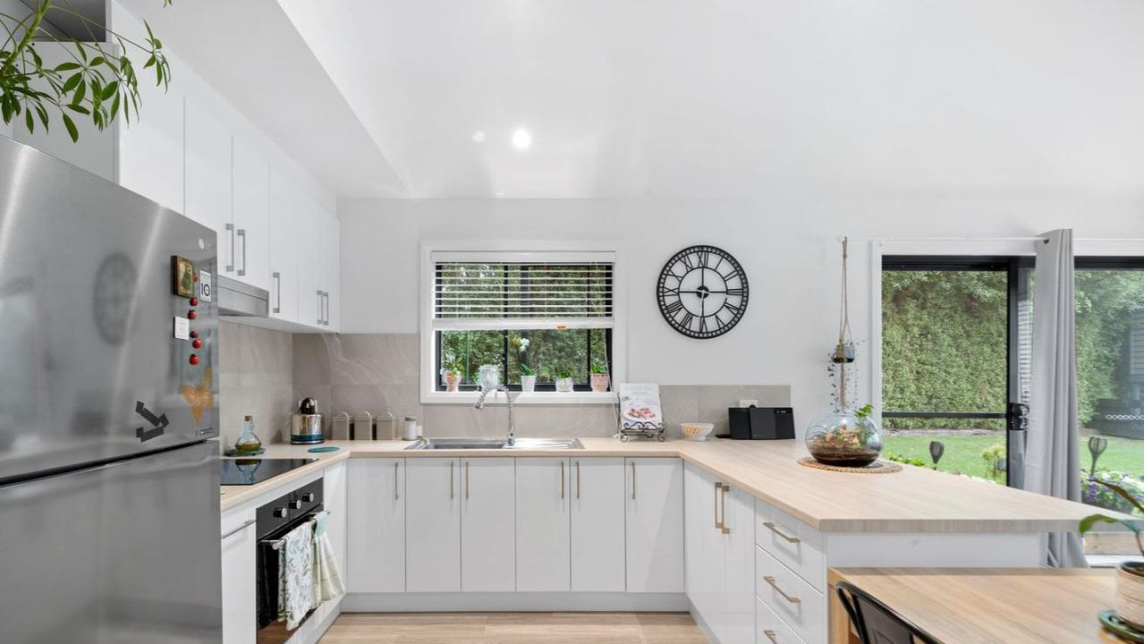 The kitchen comes fit with modern appliances.