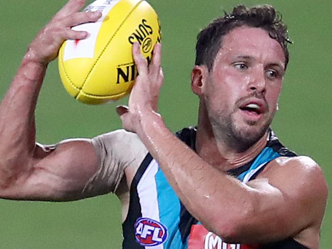 GOLD COAST, AUSTRALIA - MARCH 21: Travis Boak of the Power takes a mark during the round 1 AFL match between the Gold Coast Suns and the Port Adelaide Power at Metricon Stadium on March 21, 2020 in Gold Coast, Australia. (Photo by Jono Searle/AFL Photos/Getty Images)