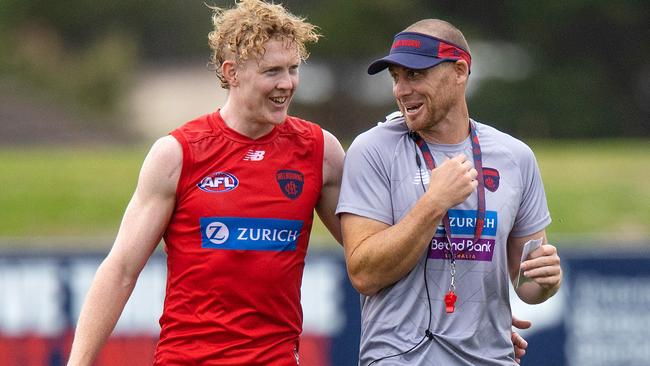 MELBOURNE, FEBRUARY 9, 2022: Melbourne Football Club coach Simon Goodwin pictured with Clayton Oliver during MFC training at Casey Fields. Picture: Mark Stewart