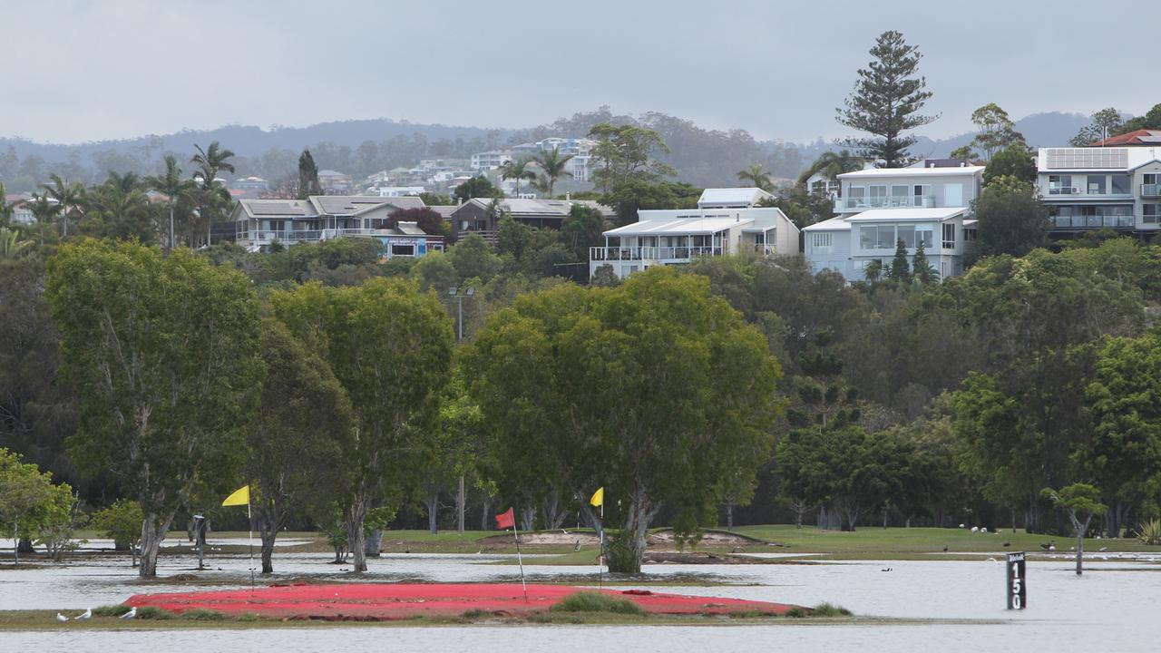 Flood water and Clean up .Practice rand at the Emerald Lakes Golf Club at Carrara. Pic Mike Batterham