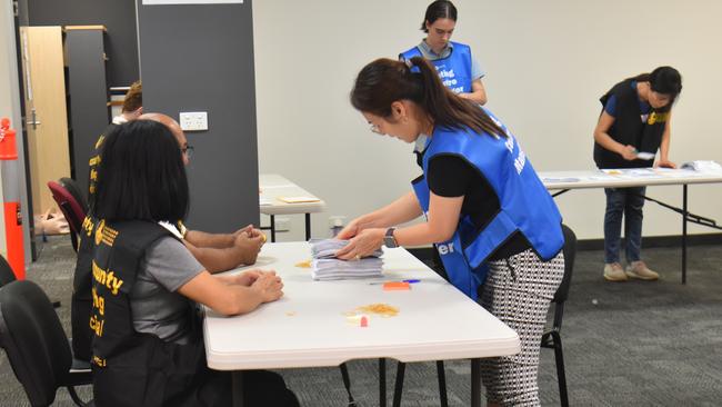 Counting in the Northern Territory local government elections. Picture: Thomas Morgan