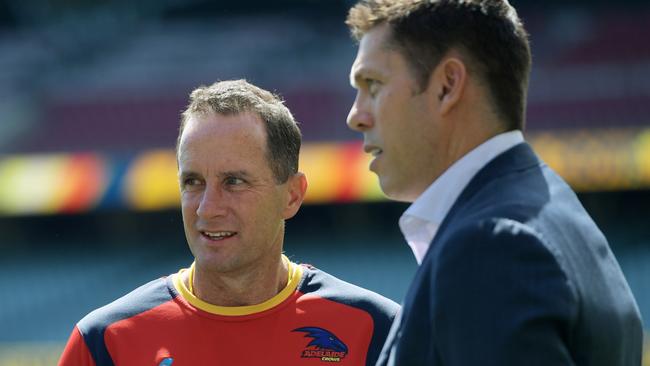 Adelaide Crows coach Don Pyke (left) and chief executive Andrew Fagan speak during a team training session at the Adelaide Oval in Adelaide, Wednesday, September 27, 2017. The Adelaide Crows face the Richmond Tigers in the AFL Grand Final in Melbourne on Saturday, September 30. (AAP Image/Tracey Nearmy) NO ARCHIVING