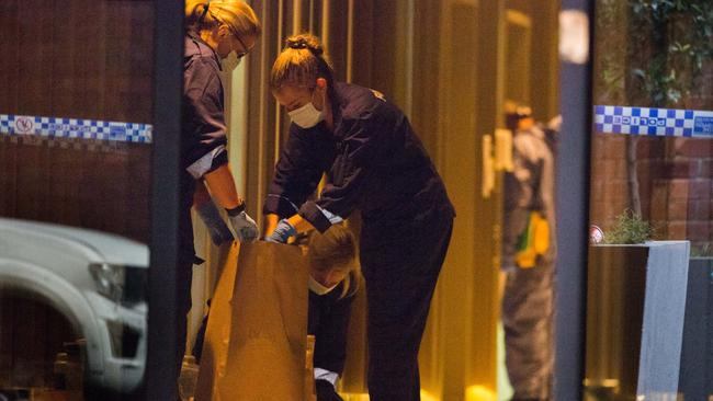 Police investigating an incident where several people were allegedly stabbed at a short-term rental property on Spencer Street in the Melbourne. Picture: NCA NewsWire / Paul Jeffers