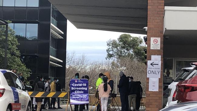 People line up at Parramatta Community Health Centre in Jeffery House for coronavirus testing on August 12.