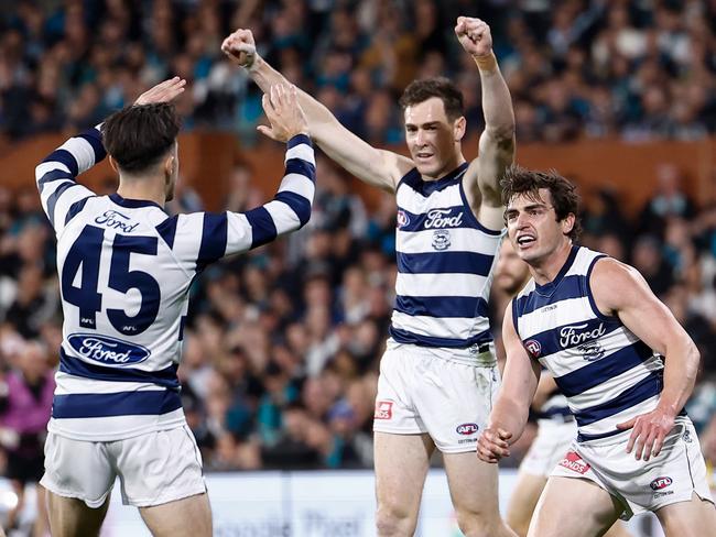 ADELAIDE, AUSTRALIA - SEPTEMBER 05: (L-R) Brad Close, Jeremy Cameron and Shaun Mannagh of the Cats celebrate during the 2024 AFL Second Qualifying Final match between the Port Adelaide Power and the Geelong Cats at Adelaide Oval on September 05, 2024 in Adelaide, Australia. (Photo by Michael Willson/AFL Photos via Getty Images)