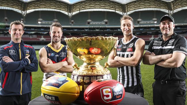 Adelaide coach Heath Younie and captain Matthew Wright with Port Adelaide skipper Cameron Sutcliffe and coach Matthew Lokan. Picture: Sarah Reed