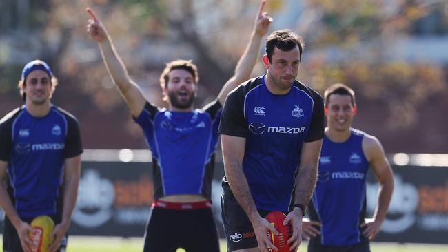 Todd Goldstein takes shots in front of a rowdy group of teammates from the spot he missed to give North the win against Fremantle — He missed three in a row. Picture: Michael Klein