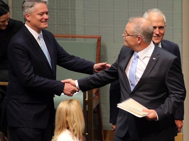 Mathias Cormann shakes Scott Morrison’s hand before the speech. Picture: Gary Ramage.