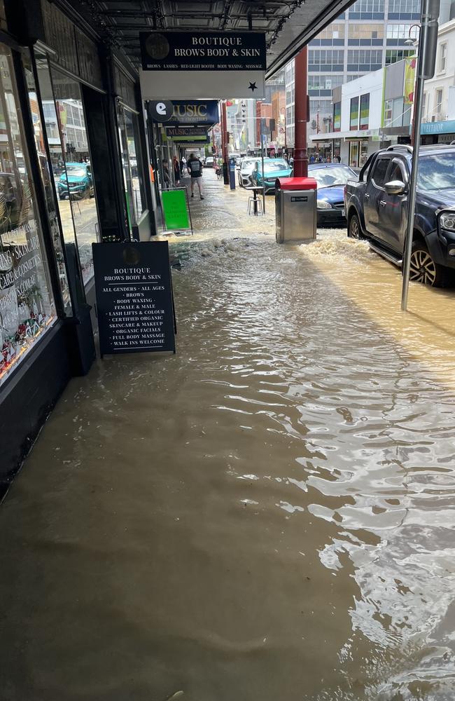 Water from the burst water main flooded Liverpool Street between Harrington and Murray Street. Picture: supplied.