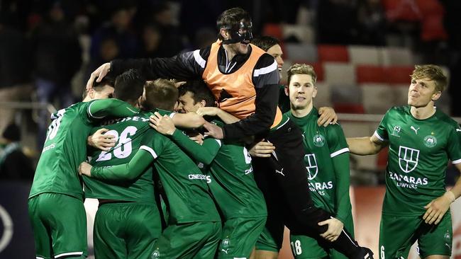 Bentleigh Greens players celebrate after their penalty shooutout win over Hume City in the FFA Cup on Wednesday night