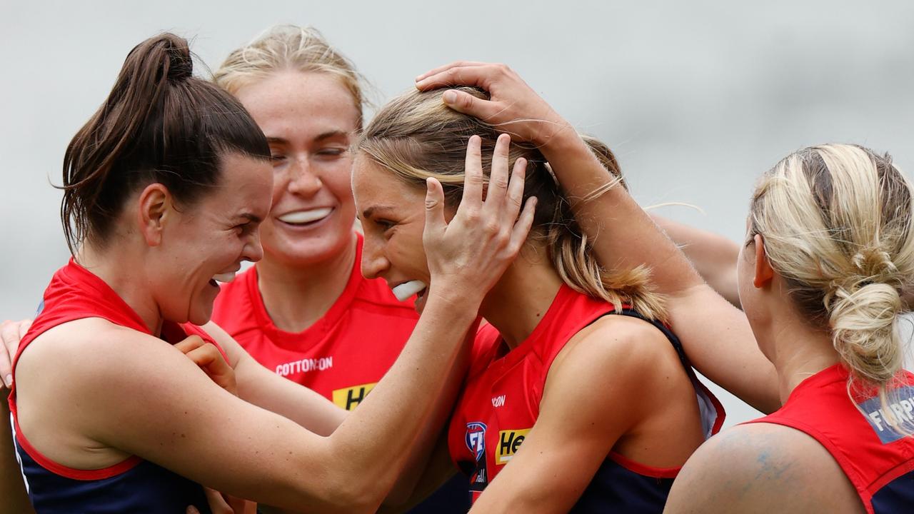 Eliza McNamara celebrates a goal with teammates during their preliminary final win against the Brisbane Lions. Picture: AFL Photos via Getty Images