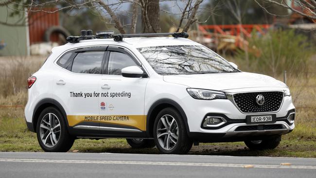 Without signs to warn drivers, mobile speed cameras raked in record revenue. Picture: Jonathan Ng