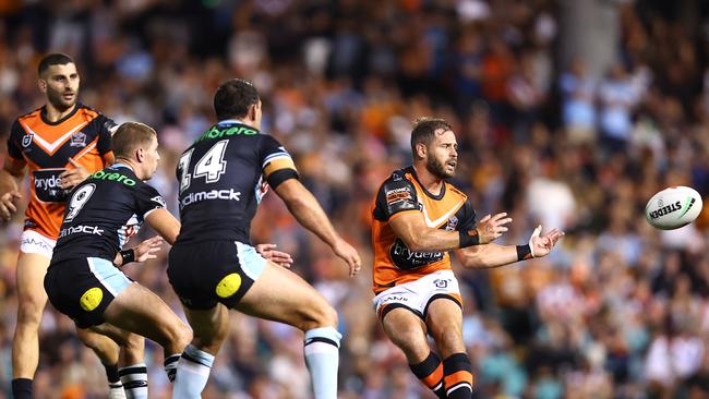 Aidan Sezer of the Tigers passes the ball during the NRL match between Wests Tigers and Cronulla Sharks. Picture: Getty Images