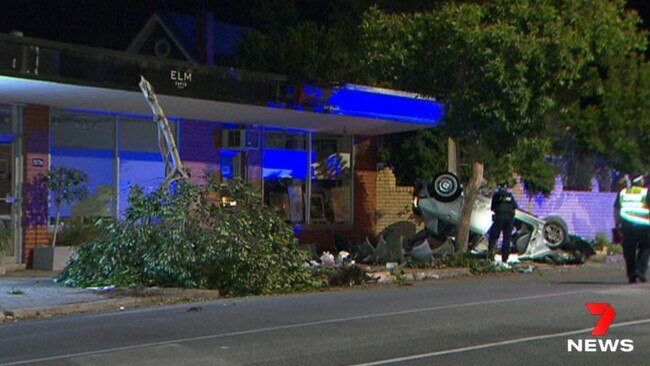 Police examine the scene of the crash on Magill Road. Picture: 7NEWS