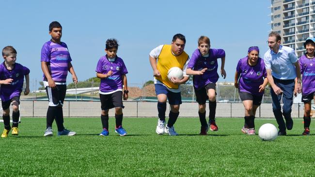 Randwick City Football Club's Purple Hearts players with Coogee Liberal MP Bruce Notley-Smith at their annual gala day at Heffron Synthetic Field. Picture: supplied.