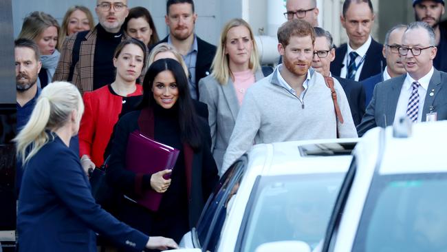 Meghan and Prince Harry arrive at Sydney International Airport. Picture: Hollie Adams/